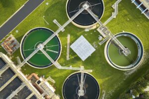 Aerial view of modern water cleaning facility at urban wastewater treatment plant.