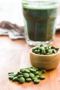 Green chlorella pills or green barley pills.