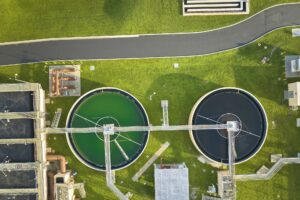 Aerial view of modern water cleaning facility at urban wastewater treatment plant.