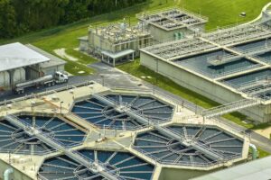 Aerial view of modern water cleaning facility at urban wastewater treatment plant.