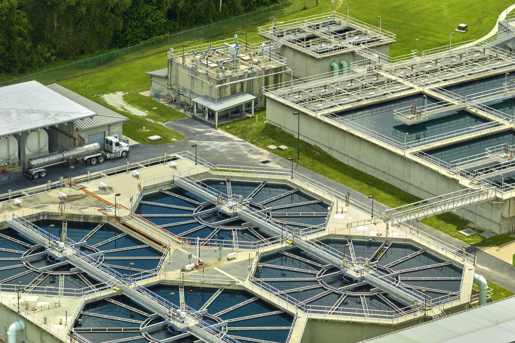 Aerial view of modern water cleaning facility at urban wastewater treatment plant.